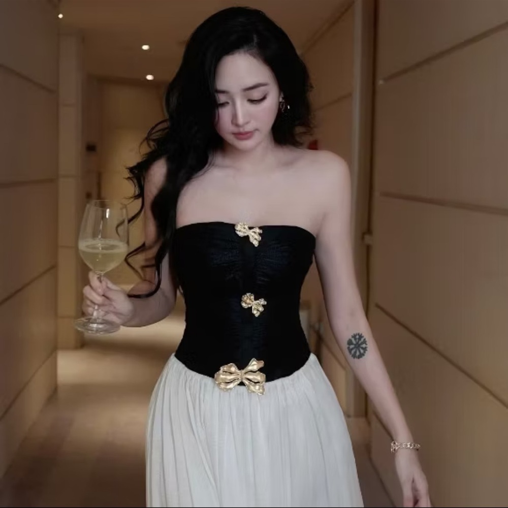 Elegant Black and White Strapless Dress with Gold Accents